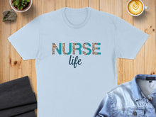 Load image into Gallery viewer, Light blue t-shirt with "NURSE life" text in leopard print.