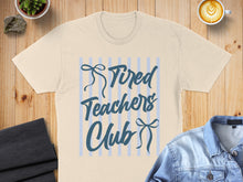 Load image into Gallery viewer, Cream t-shirt with blue stripes and "Tired Teachers Club" text.