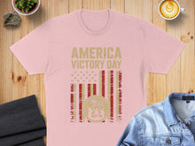 Load image into Gallery viewer, Pink t-shirt with "America Victory Day May 08" text and flag design.