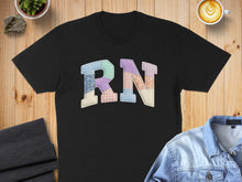 Load image into Gallery viewer, Black t-shirt with colorful patchwork "RN" letters.