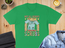 Load image into Gallery viewer, Green t-shirt with text "Not all heroes wear capes, some wear scrubs" and stethoscope.