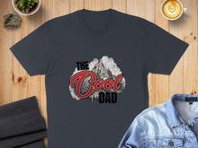 Load image into Gallery viewer, Dark grey t-shirt with "The Cool Dad" text and mountain graphic.
