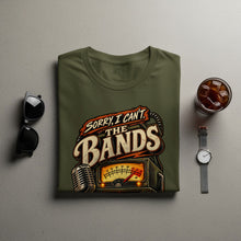 Load image into Gallery viewer, Olive green t-shirt with "Sorry, I Can't. The Bands" graphic featuring microphone and meter.