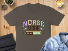 Load image into Gallery viewer, Dark brown t-shirt with "NURSE MODE ALL DAY EVERY DAY" text and medical icons.
