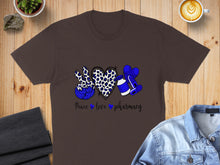 Load image into Gallery viewer, Brown t-shirt with blue leopard print peace sign, heart, and pills design.