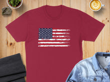 Load image into Gallery viewer, Maroon t-shirt with a distressed American flag graphic, coffee, and denim jacket.