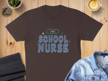 Load image into Gallery viewer, Brown t-shirt with "SCHOOL NURSE" text and band-aid graphic.