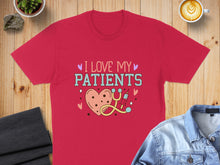 Load image into Gallery viewer, Red t-shirt with "I Love My Patients" text, heart, and stethoscope graphic.