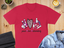 Load image into Gallery viewer, Red t-shirt with "peace love laboratory" text and science-themed icons.