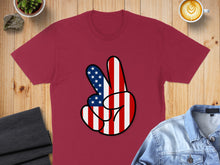 Load image into Gallery viewer, Maroon t-shirt with red, white, and blue striped peace sign hand graphic.