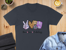 Load image into Gallery viewer, T-shirt with peace sign, heart, and radiology icons, text "Peace Love Radiology".