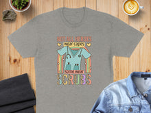 Load image into Gallery viewer, Gray t-shirt with "Not all heroes wear capes. Some wear scrubs" and stethoscope design.