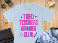Load image into Gallery viewer, Light blue t-shirt with "Tired Teachers Summer Club" text and pencil graphic.