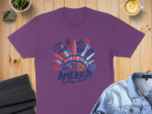 Load image into Gallery viewer, Purple t-shirt with "Land of the Free 4th of July 1776" graphic.
