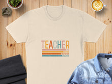Load image into Gallery viewer, Cream t-shirt with colorful "TEACHER" text and stripes.