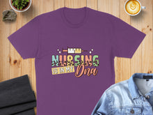 Load image into Gallery viewer, Purple t-shirt with "Nursing is in my DNA" text and syringe graphic.