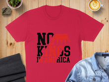 Load image into Gallery viewer, Red t-shirt with black "NO KINGS" text and red graphic, on a wooden surface.