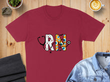 Load image into Gallery viewer, Maroon t-shirt with "RN" design featuring a stethoscope and eyes.