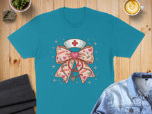 Load image into Gallery viewer, Teal t-shirt with pink bow, stethoscope, and heart nurse graphic.