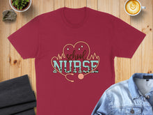 Load image into Gallery viewer, Maroon t-shirt with "School Nurse" text and stethoscope design.