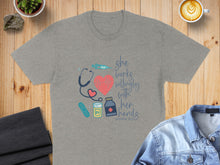 Load image into Gallery viewer, Grey t-shirt with medical icons and "she works willingly with her hands" text.