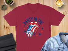 Load image into Gallery viewer, Red t-shirt with Rolling Stones logo tongue and USA flag, "Party in the USA" text.