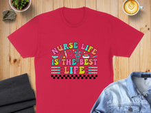 Load image into Gallery viewer, Red t-shirt with "Nurse Life is the Best Life" in colorful, playful lettering.