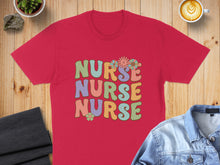 Load image into Gallery viewer, Red t-shirt with "NURSE NURSE NURSE" in colorful, retro lettering and flowers.