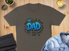Load image into Gallery viewer, Brown t-shirt with "Dad" in large blue letters surrounded by words like "Funny", "Protector", and "Loving".