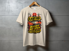 Load image into Gallery viewer, T-shirt with "Caution: Bands May Open Without Warning" graphic and vintage radio equipment.