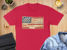 Load image into Gallery viewer, Red t-shirt featuring a rustic American flag made of patchwork fabric.