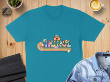 Load image into Gallery viewer, Teal t-shirt with retro "Nurse" text featuring flowers and a nurse cap.
