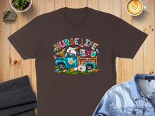 Load image into Gallery viewer, Brown t-shirt featuring a vintage blue truck filled with medical supplies and "Nurse Life" text.