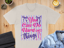 Load image into Gallery viewer, "You Can Do Hard Things" text with ribbons and stars on a t-shirt.