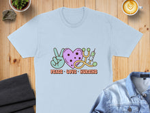 Load image into Gallery viewer, Light blue t-shirt with peace sign, heart, and stethoscope graphic and text.