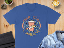 Load image into Gallery viewer, Blue t-shirt with "Coffee, Scrubs & Rubber Gloves" text and medical icons.