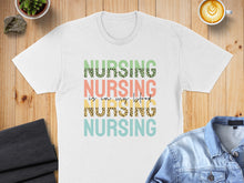 Load image into Gallery viewer, White t-shirt with "NURSING is in my BLOOD" leopard print text.