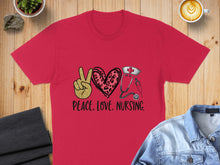 Load image into Gallery viewer, Red t-shirt with leopard print peace sign, stethoscope, and heart.