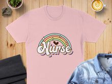Load image into Gallery viewer, Pink t-shirt with "Nurse" text and a rainbow graphic.
