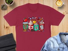 Load image into Gallery viewer, Maroon t-shirt with cartoon coffee cups labeled "School Nurse Fuel."