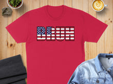 Load image into Gallery viewer, Red t-shirt with "BRUH" text in American flag design.