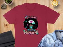 Load image into Gallery viewer, Burgundy t-shirt with text "Nursing is a work of Heart" and cartoon nurse illustration.