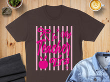 Load image into Gallery viewer, Brown t-shirt with pink text "In My Teacher Era" and a pink bunny graphic.