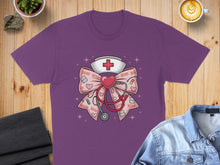 Load image into Gallery viewer, Purple t-shirt featuring a pink bow with stethoscope, nurse hat, and XOXO hearts.
