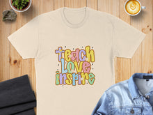 Load image into Gallery viewer, T-shirt with "Teach Love Inspire" text and floral accents.