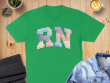 Load image into Gallery viewer, Green t-shirt with "RN" graphic made of patchwork fabric.