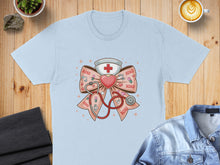 Load image into Gallery viewer, Light blue t-shirt featuring a stethoscope and nurse hat on a pink bow with "XOXO" text.