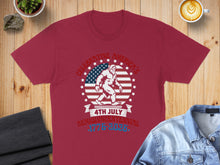 Load image into Gallery viewer, Maroon t-shirt with Bigfoot silhouette, American flag, and "Celebrating America's Semiquincentennial 1776-2026" text.