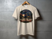 Load image into Gallery viewer, Cream t-shirt with "THE BANDS COME ALIVE AFTER DARK" graphic.