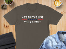 Load image into Gallery viewer, Dark gray t-shirt with "HE'S ON THE LIST YOU KNOW IT" in white and red stripes.